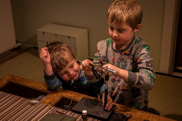 My kids using my fly tying vise